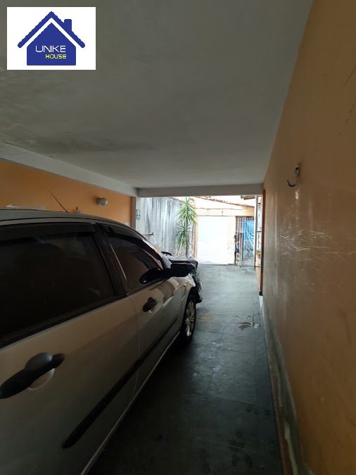 Terreno com Duas Casas e Área Gourmet: Ideal para Investimento